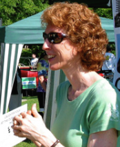 Picture of a red-headed woman with sunglasses on