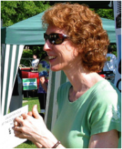 Picture of a red-headed woman wearing sunglasses